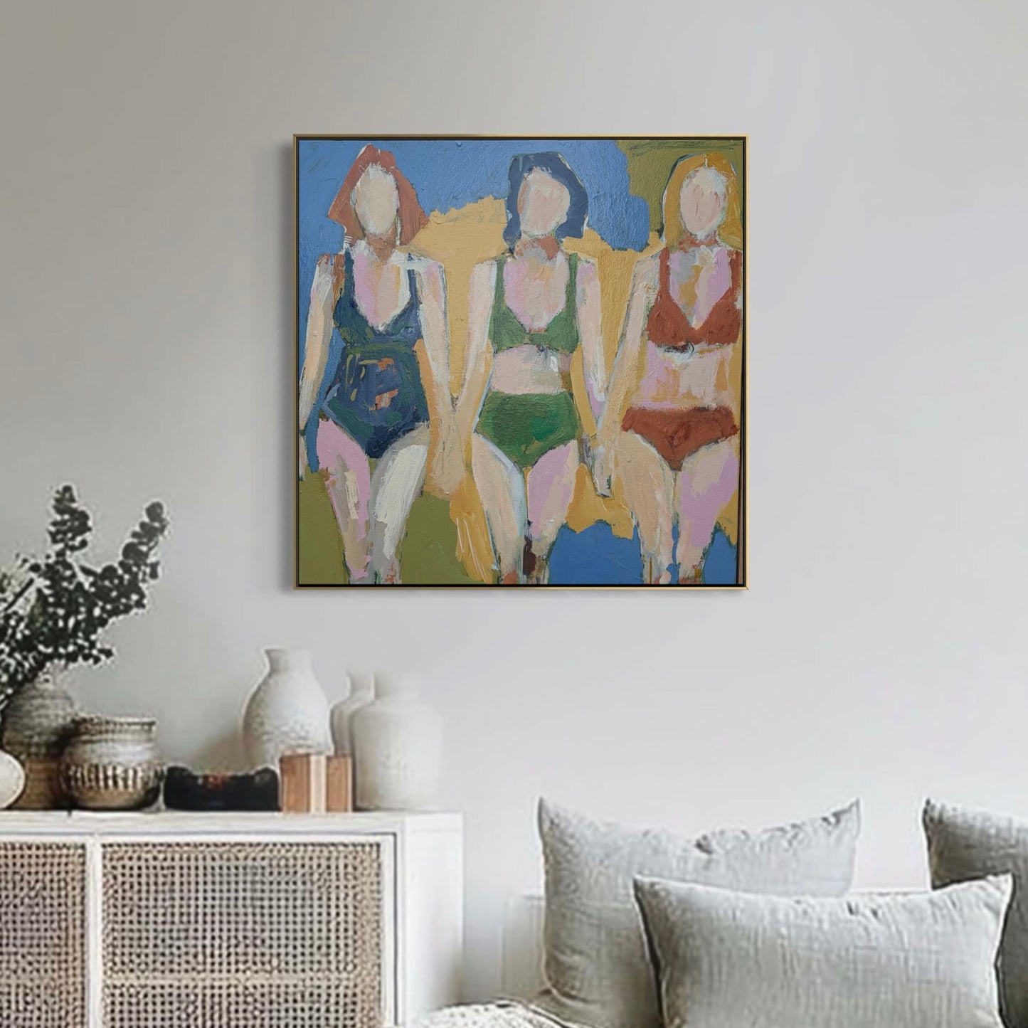 Abstract painting of three figures in swimsuits on a wall above a white cabinet with decorative items.Refuse To SettleLead Me Astray - Rose Hewartson Original Abstract Painting on Canvas Framed 83x83 cm Statement Piece